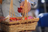 close up of flower petals being taken from a wicker based on a sunny day
