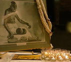 photo of Gandhi portrait and candles from previous Memorial event